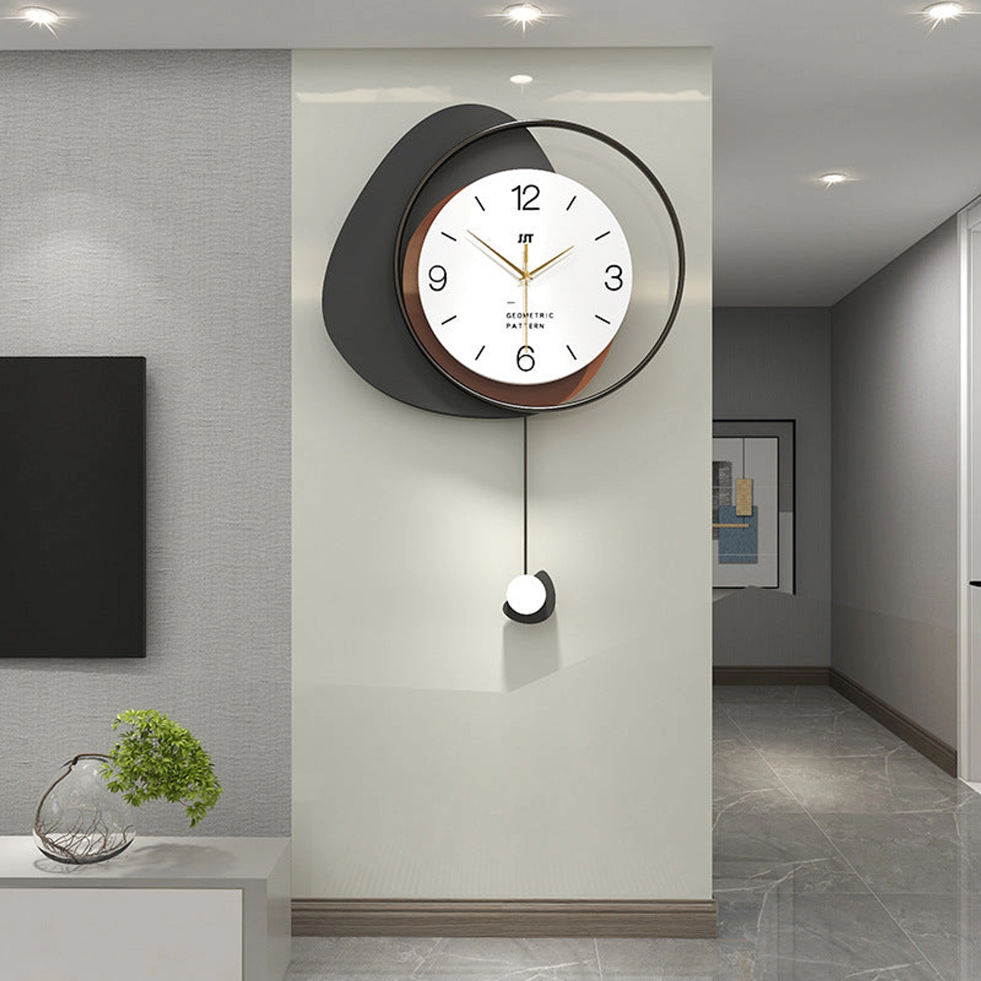 Modern Minimalist Wall Clock with Layered Pebble Design and Subtle Pendulum Accent Carousel 1