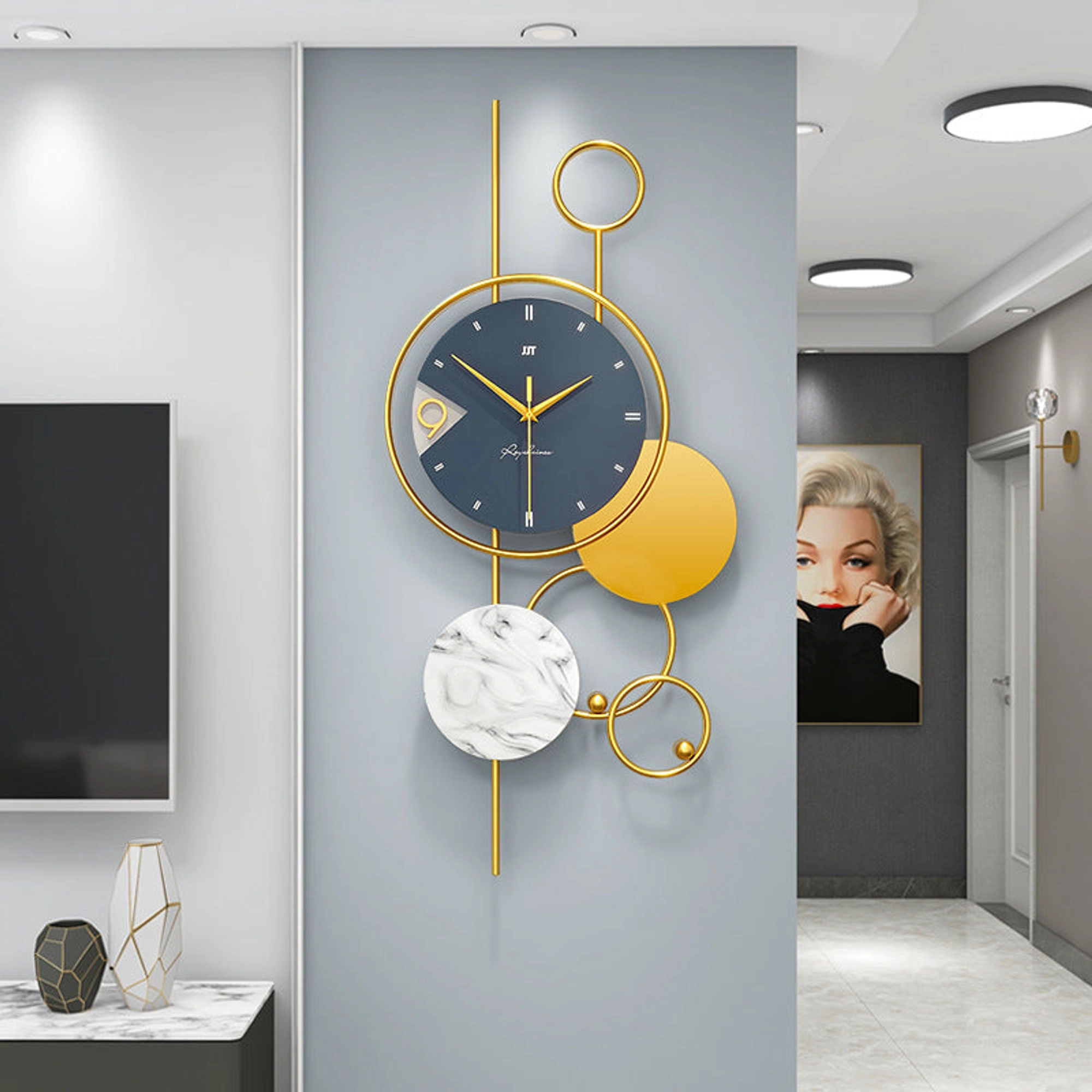 Modern Wall Clock with Gold Accents and Marble Disc Carousel 1