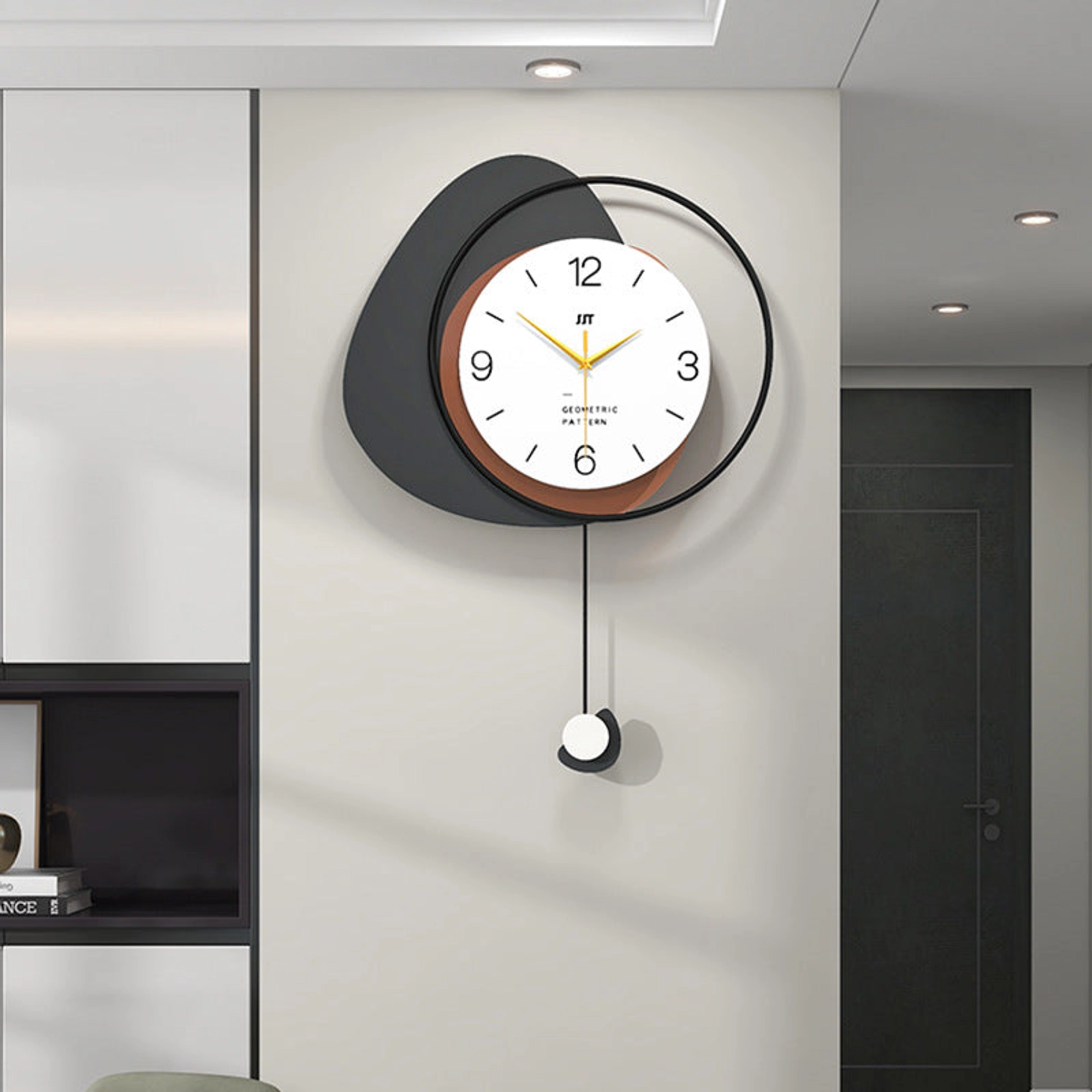 Modern Minimalist Wall Clock with Layered Pebble Design and Subtle Pendulum Accent Carousel 2