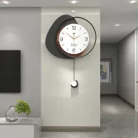 Modern Minimalist Wall Clock with Layered Pebble Design and Subtle Pendulum Accent Carousel 1