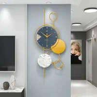 Modern Wall Clock with Gold Accents and Marble Disc Carousel 1