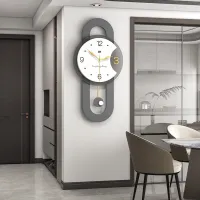 Minimalist Gray Wall Clock with Gold Pendulum and Charcoal Frame Carousel 1