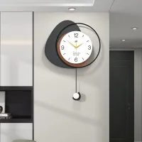 Modern Minimalist Wall Clock with Layered Pebble Design and Subtle Pendulum Accent Carousel 2
